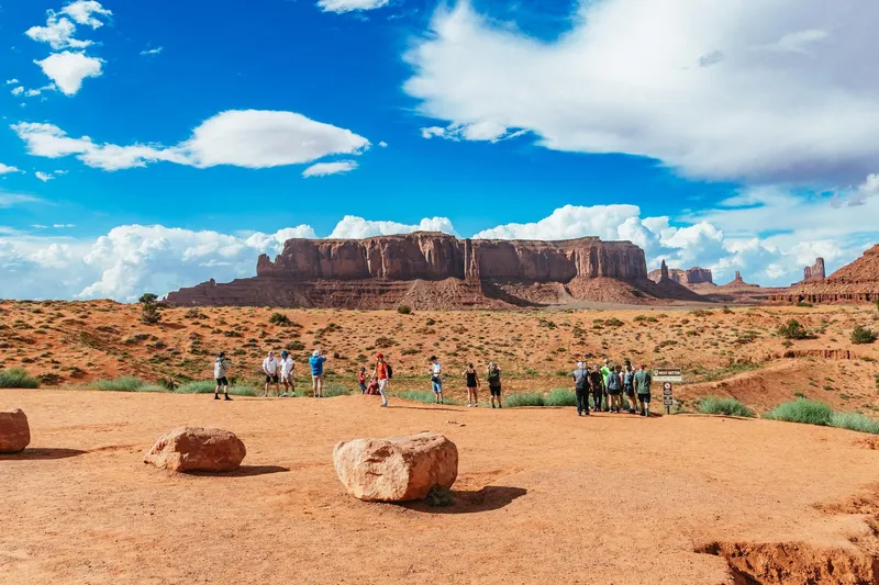 Red sandstone buttes glowing at sunset on a Monument Valley sunset jeep tour with Navajo guide, Arizona