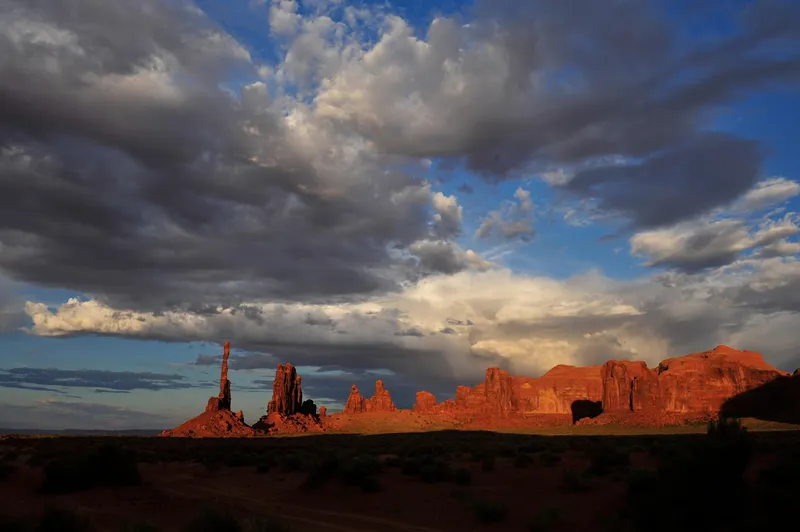 Jeep at John Ford's Point during golden hour on a guided Monument Valley sunset jeep tour, Navajo Tribal Park